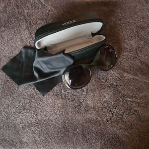 Vogue Sunglasses brown with gold trim accent temple and/or arm.